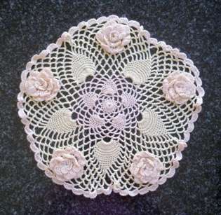 Pretty crochet doilie in lime and cream thread 25cm