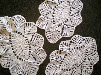 Three pretty white cotton crochet doilies
