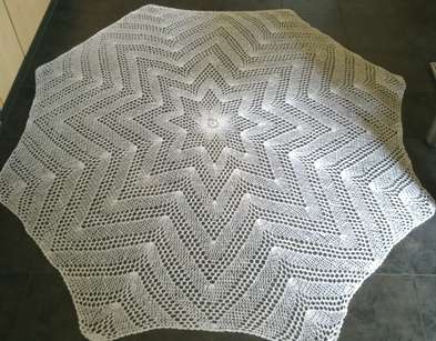 Lacy hexagonal white cotton crochet tablecloth