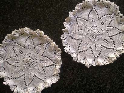 Unusual pretty pair of knitted doilies 19cm