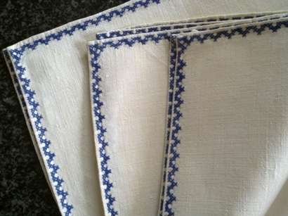 Beautiful set of eight embroidered linen dinner serviettes
