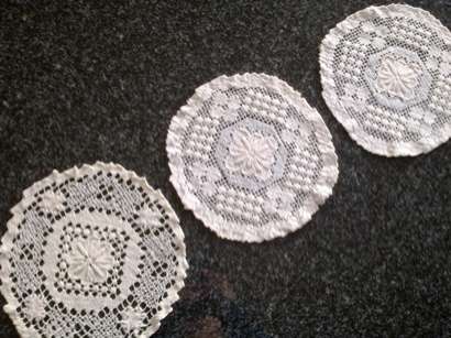 Three lovely hand knotted lace doilies