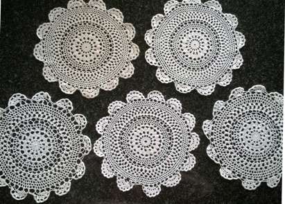Five white cotton crochet doilies 23cm