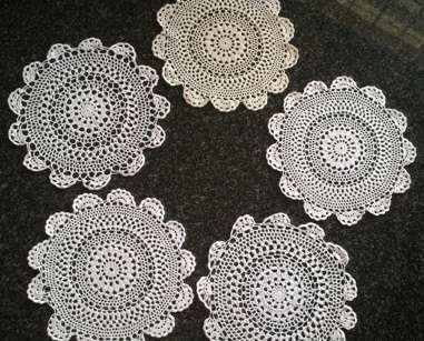Five white cotton crochet doilies 23cm