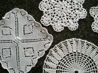 Five white mini doilies