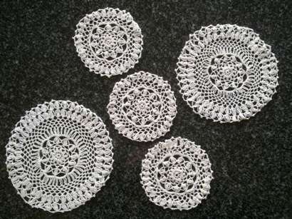 Pretty set of five crochet doilies