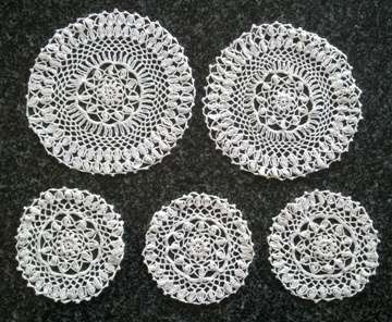 Pretty set of five crochet doilies