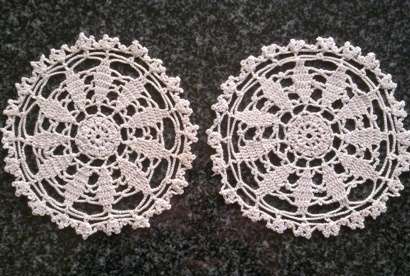 Two pretty small cream crochet doilies 13cm