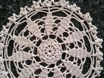 Two pretty small cream crochet doilies 13cm