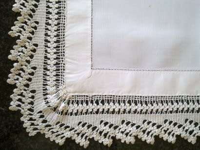 Striking antique white linen centre piece