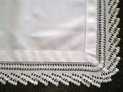 Striking antique white linen centre piece