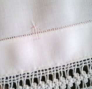 Striking antique white linen centre piece