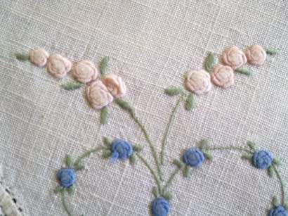 Dainty hand embroidered linen doilie 21cm