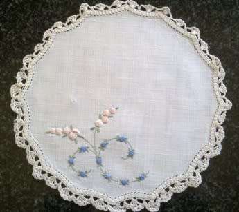 Dainty hand embroidered linen doilie 21cm