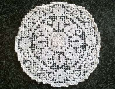 Collection of hand knotted lace doilies