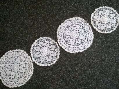 Collection of hand knotted lace doilies