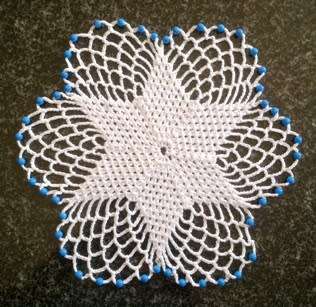 Pretty six point flower glass beaded doilie 22cm