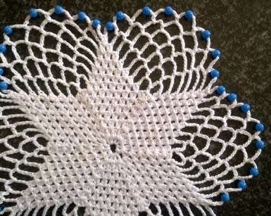 Pretty six point flower glass beaded doilie 22cm