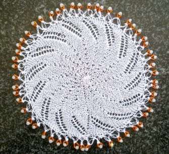 Unusual knitted glass beaded doilie