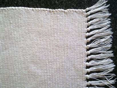 White cotton floor rug / bath mat with fringing