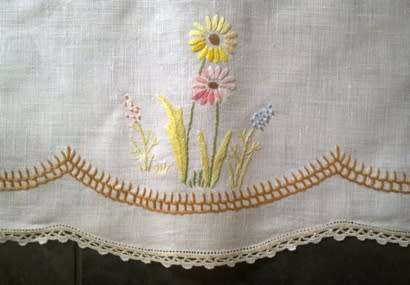 Charming hand embroidered crisp white linen tablecloth