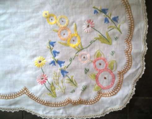 Charming hand embroidered crisp white linen tablecloth
