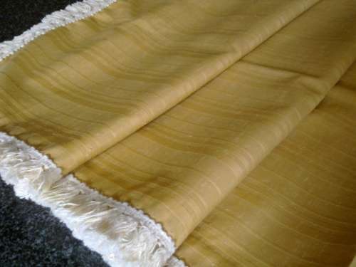 Large gold tablecloth with tassel trim