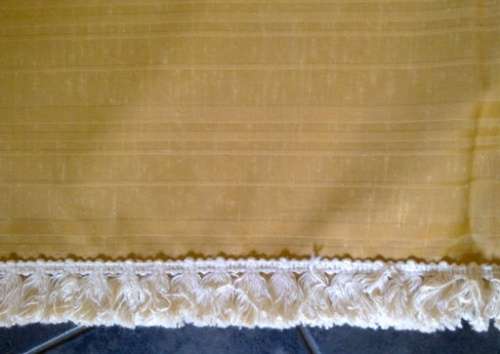 Large gold tablecloth with tassel trim