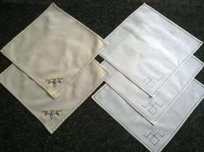 Five embroidered cocktail napkins