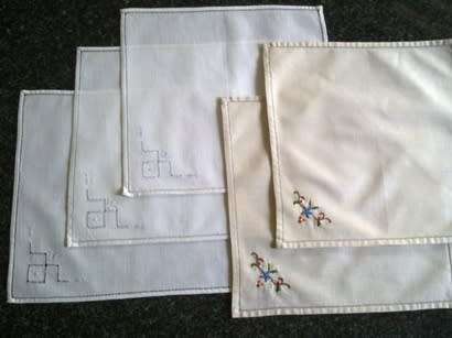 Five embroidered cocktail napkins