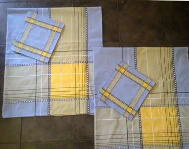 Matching pair of tea tablecloths and 12 napkins
