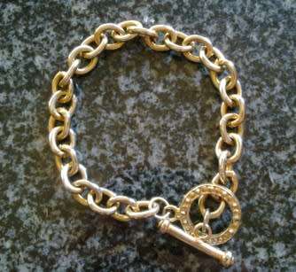 Gold metal link bracelet with toggle