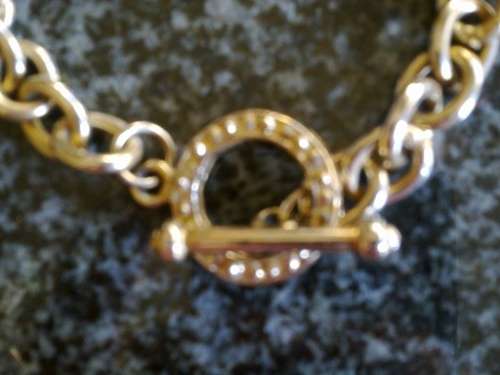 Gold metal link bracelet with toggle