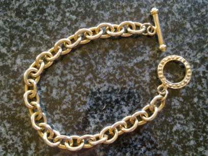 Gold metal link bracelet with toggle