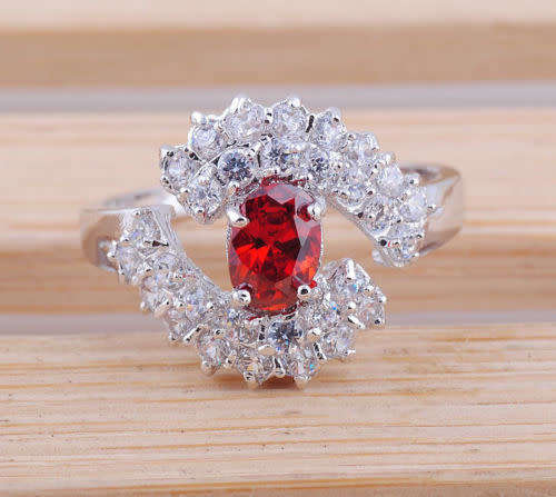 Oval cut garnet red gemstone silver ring