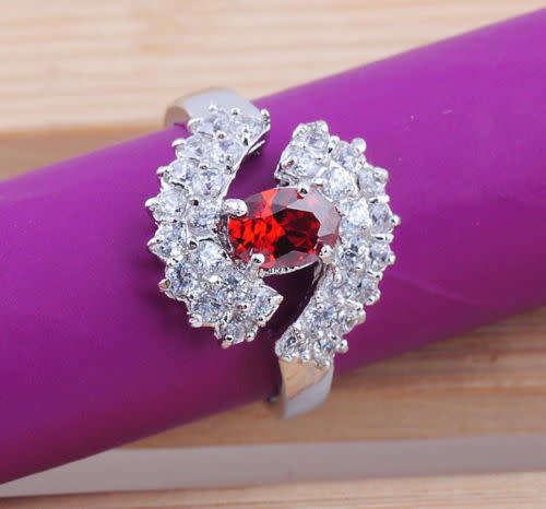 Oval cut garnet red gemstone silver ring