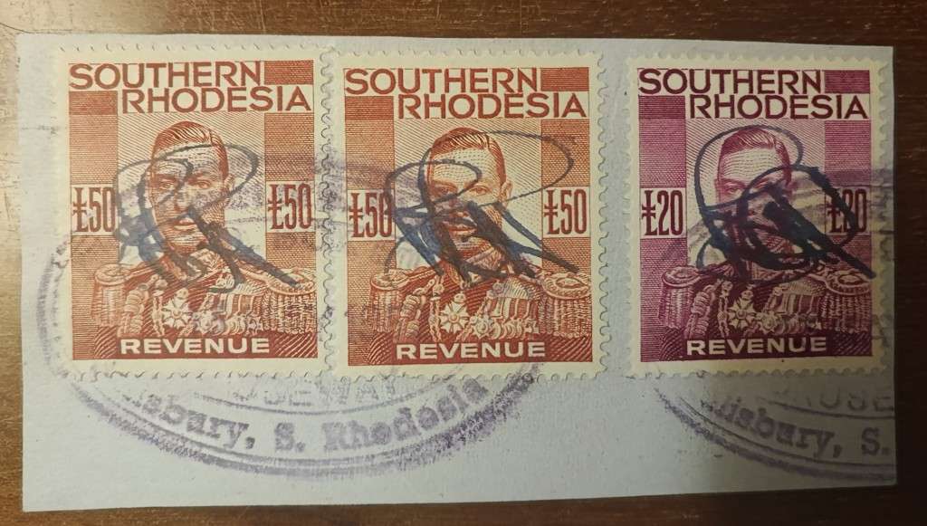 Revenue stamps Southern Rhodesia KG VI £50 x2 and £20 revenue stamps on piece