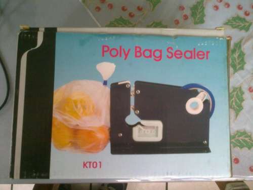 Poly Bag Sealer with reels of tape