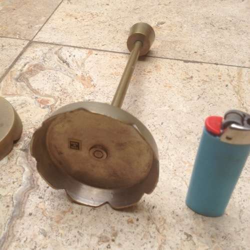 three brass candle stick holders , made in india