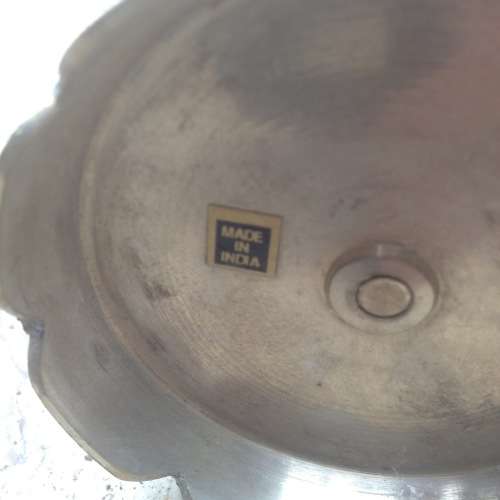 three brass candle stick holders , made in india