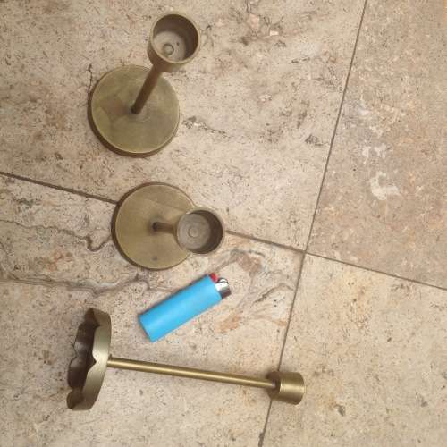 three brass candle stick holders , made in india