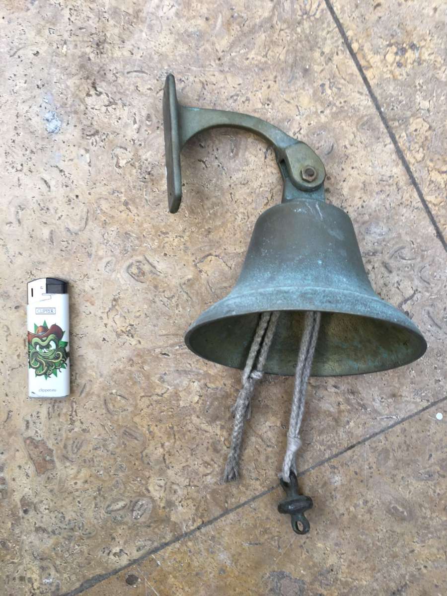 vintage brass ships bell on mounting bracket
