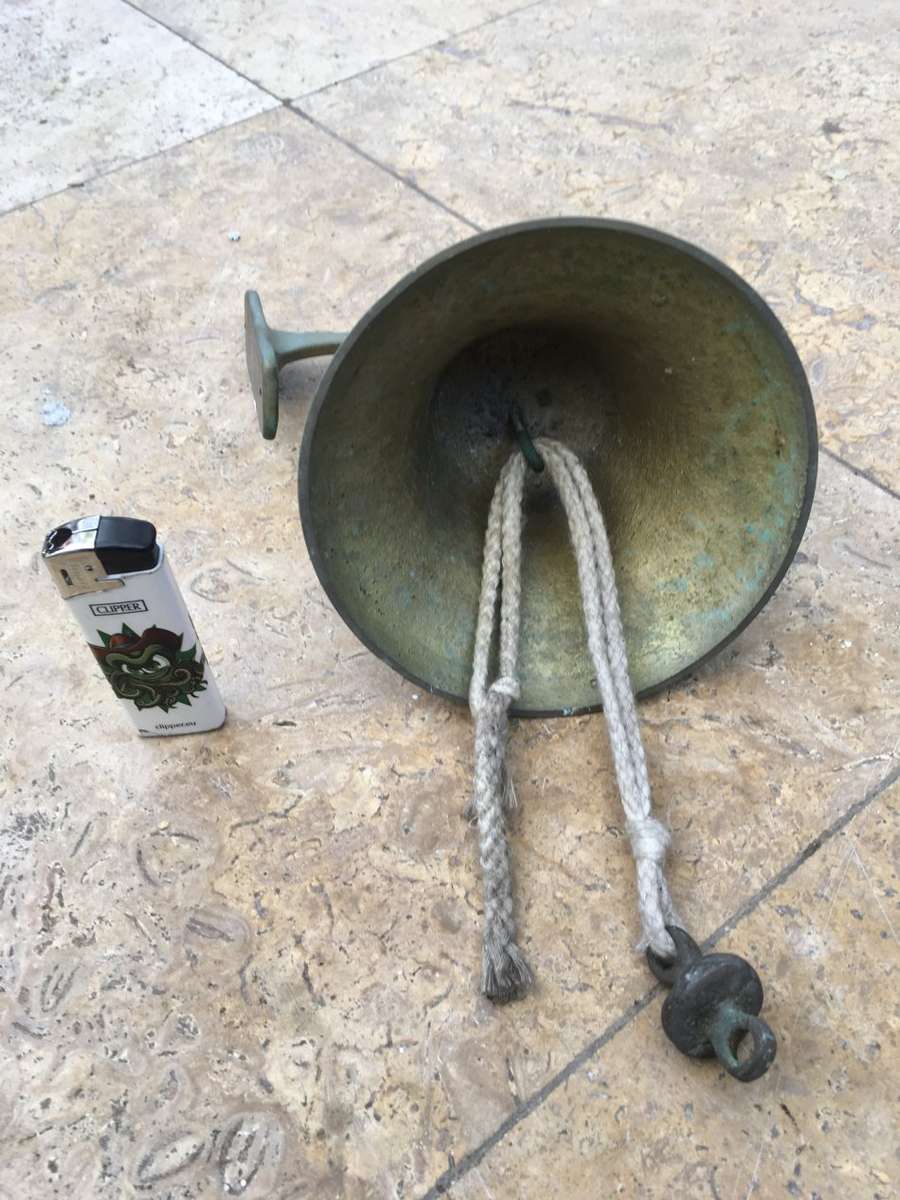vintage brass ships bell on mounting bracket