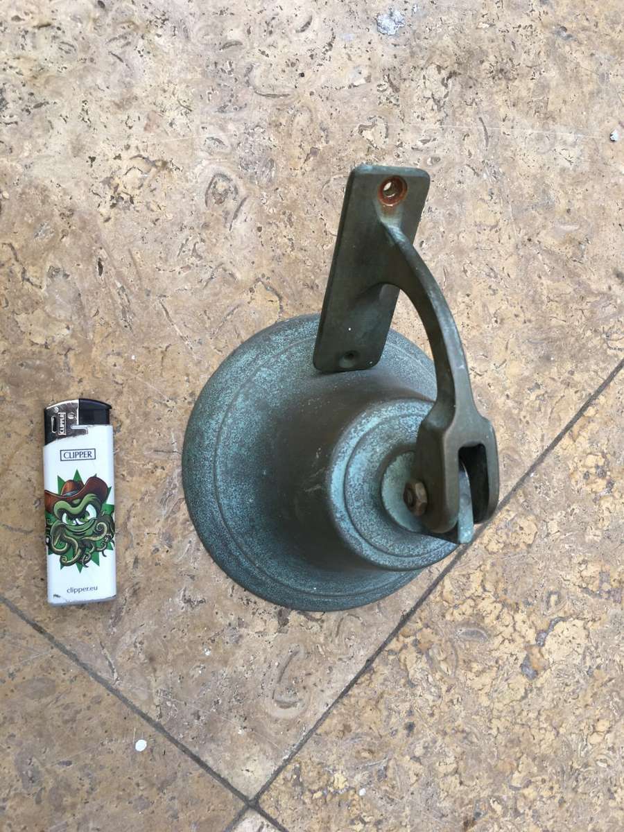 vintage brass ships bell on mounting bracket