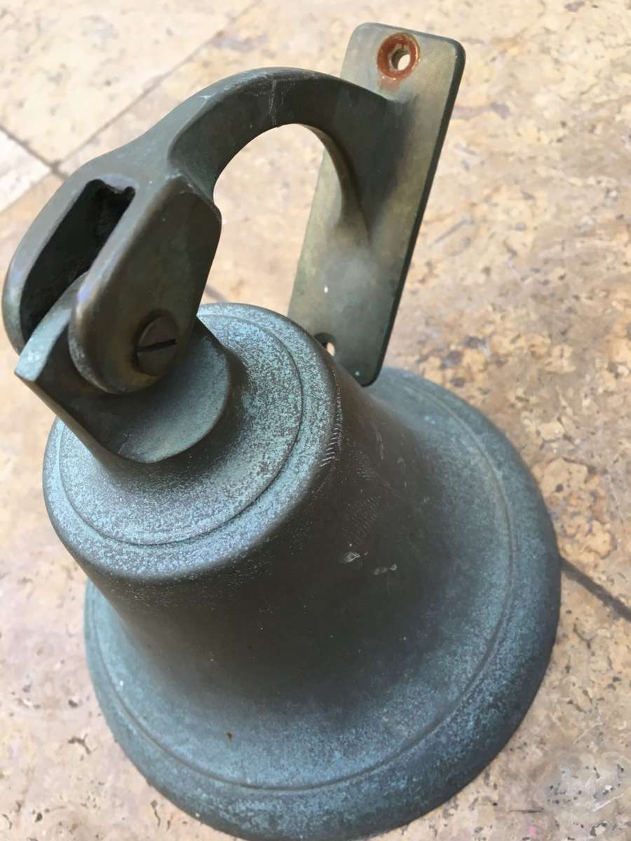 vintage brass ships bell on mounting bracket