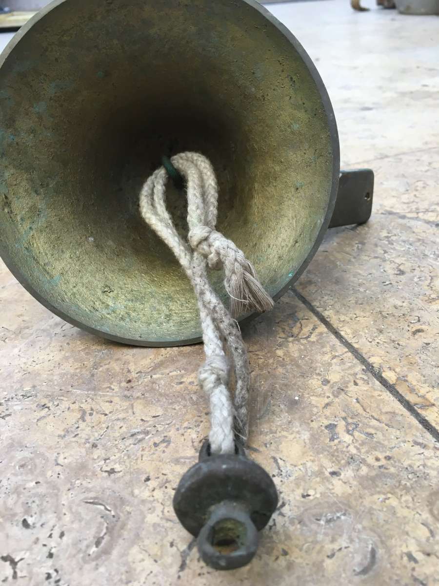 vintage brass ships bell on mounting bracket