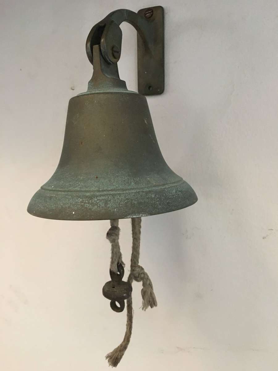 vintage brass ships bell on mounting bracket