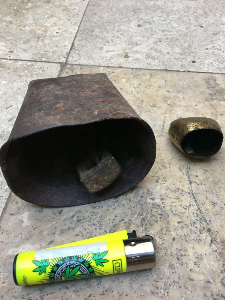 vintage primitive Cow bell , with a small swiss cow bell small