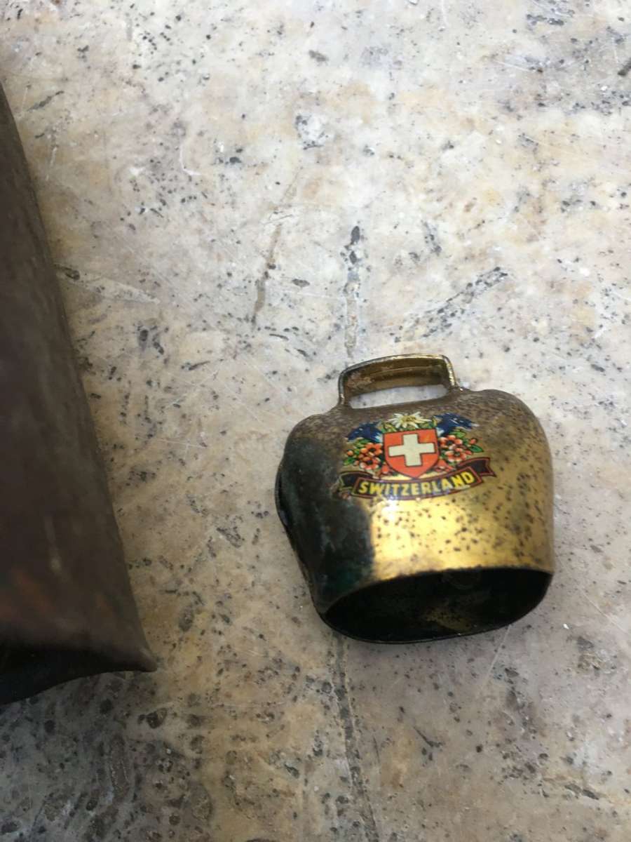 vintage primitive Cow bell , with a small swiss cow bell small