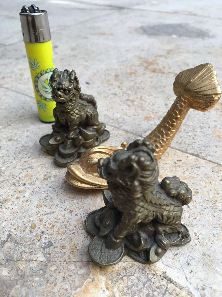 brass foo dog dogs pair with a brass fish